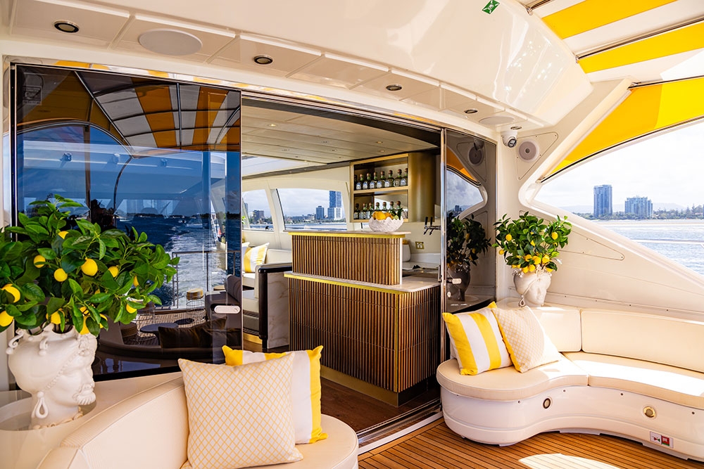 Deck area with seating and door to interior YOT Club Capri 