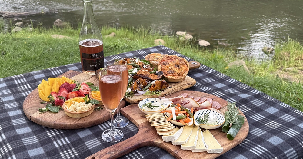 Artsian picnic spread by river at O'reilly's Canungra